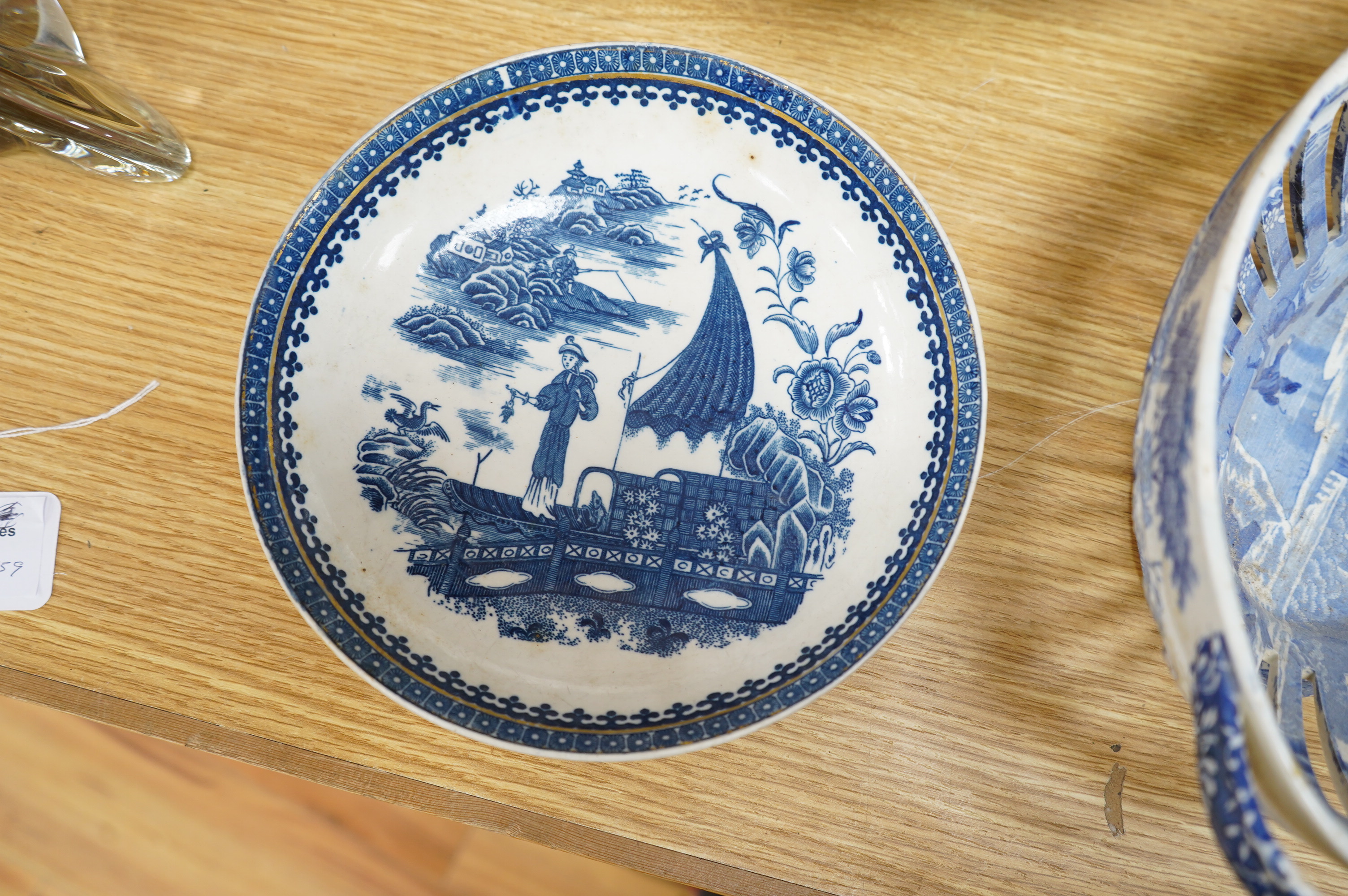 A Spode blue and white oval basket, a Spode two-handled pedestal dish, a Caughley Fisherman pattern saucer dish and two other items, largest 38cm wide. Condition - varies